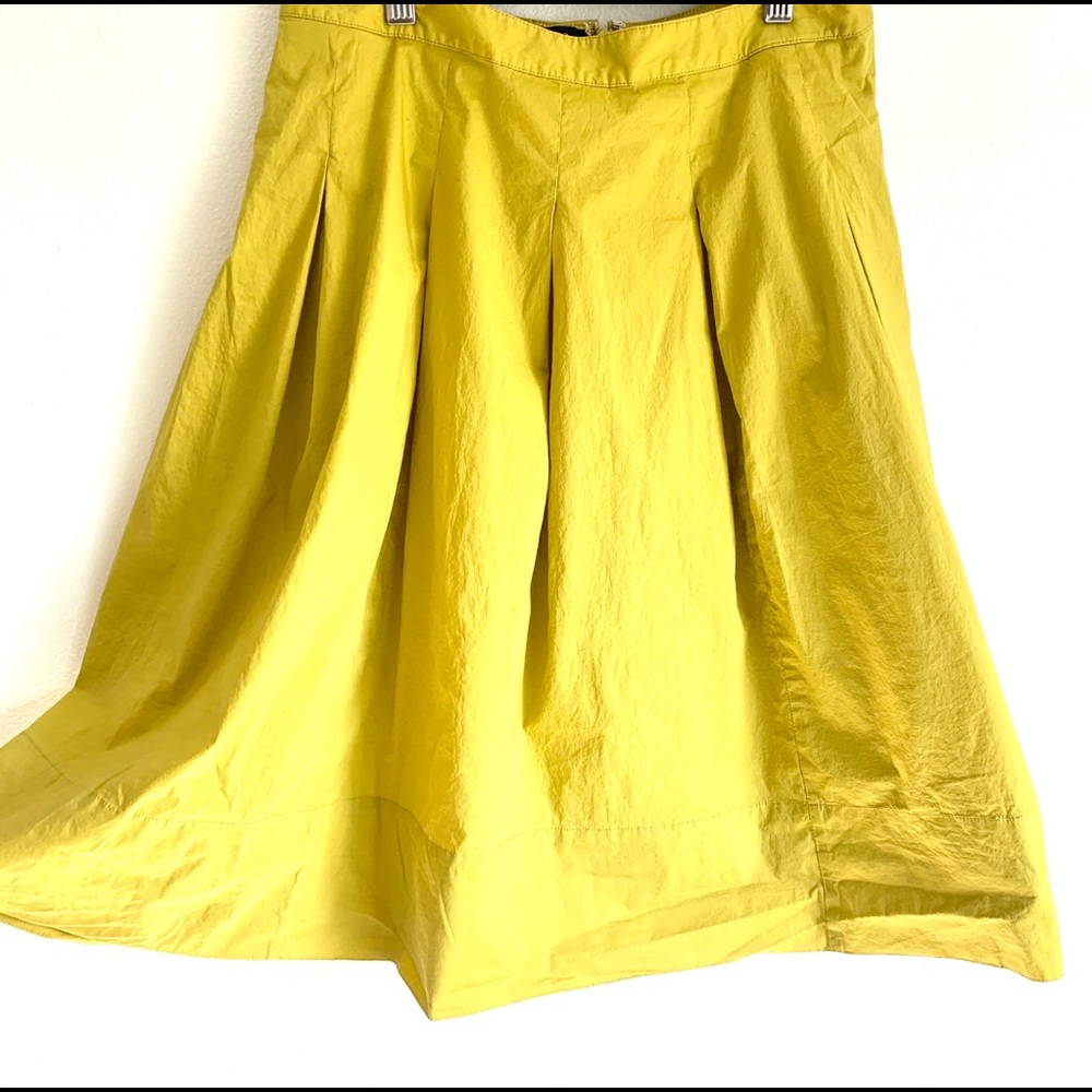 Mustard colored skater skirt.